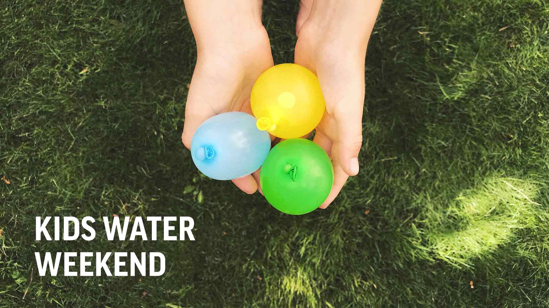 hands holding water balloons