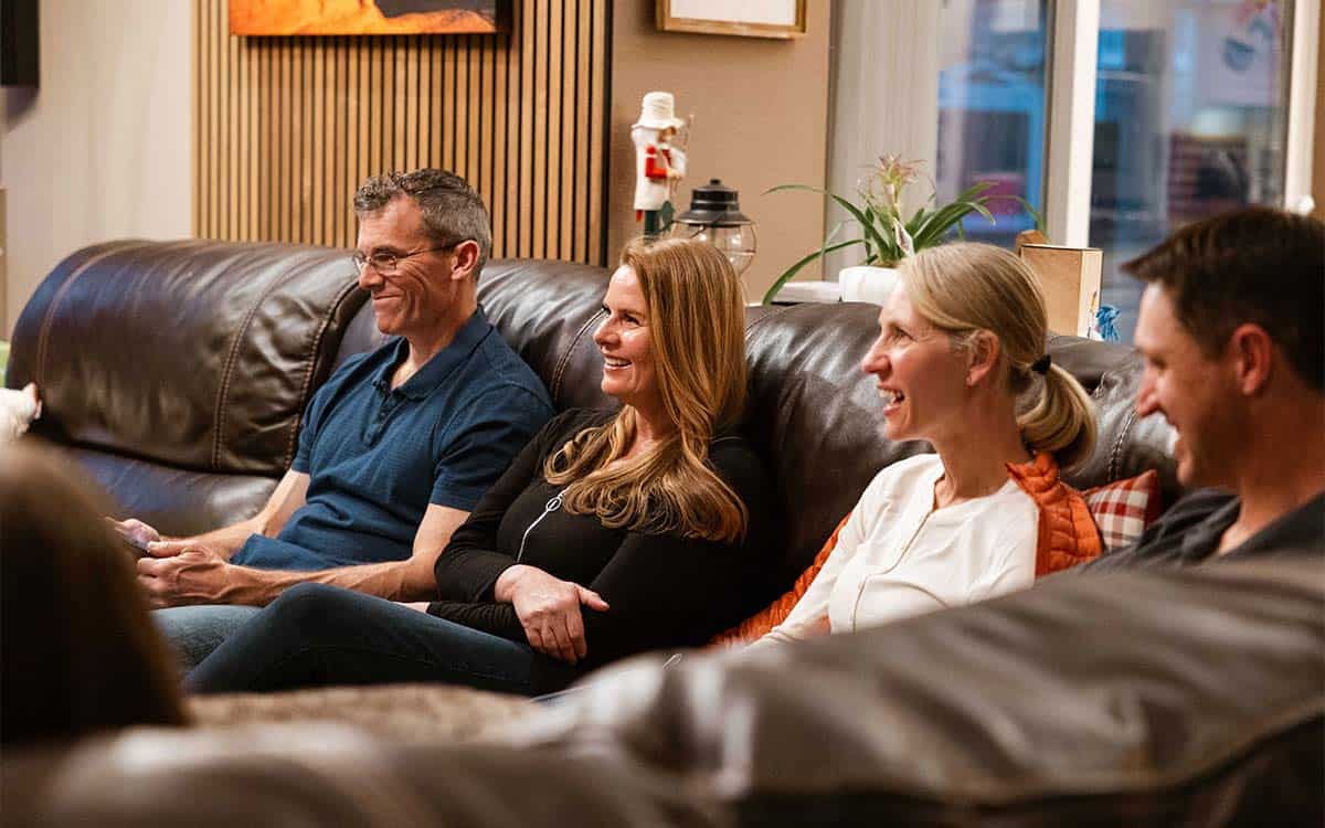 connect cta image group of people sitting on a couch smiling